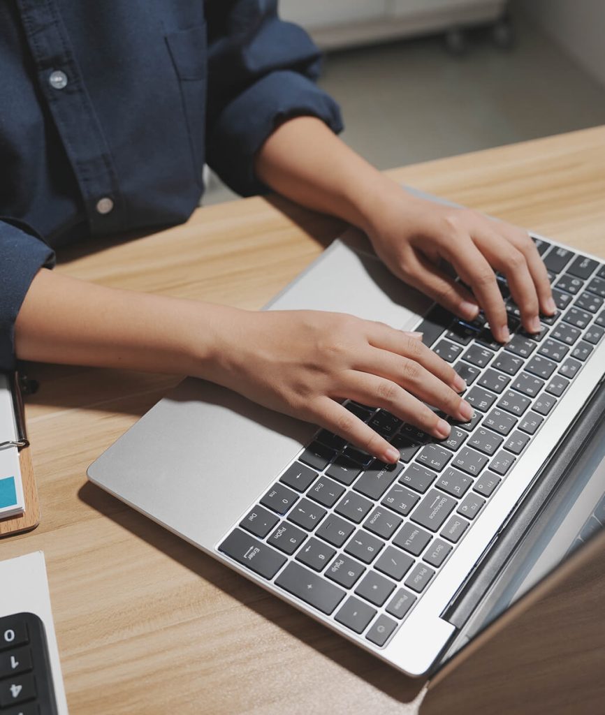 Person typing on laptop