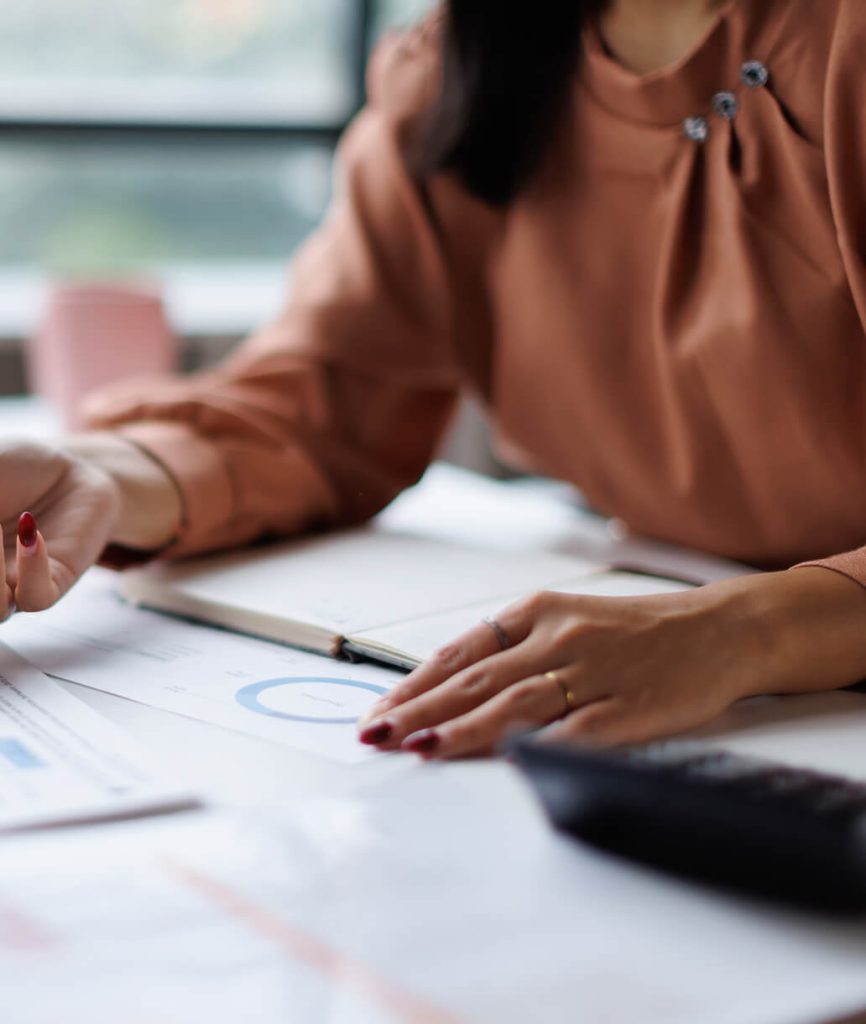 Woman examines financial documents